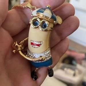 Minion golfer pendant.